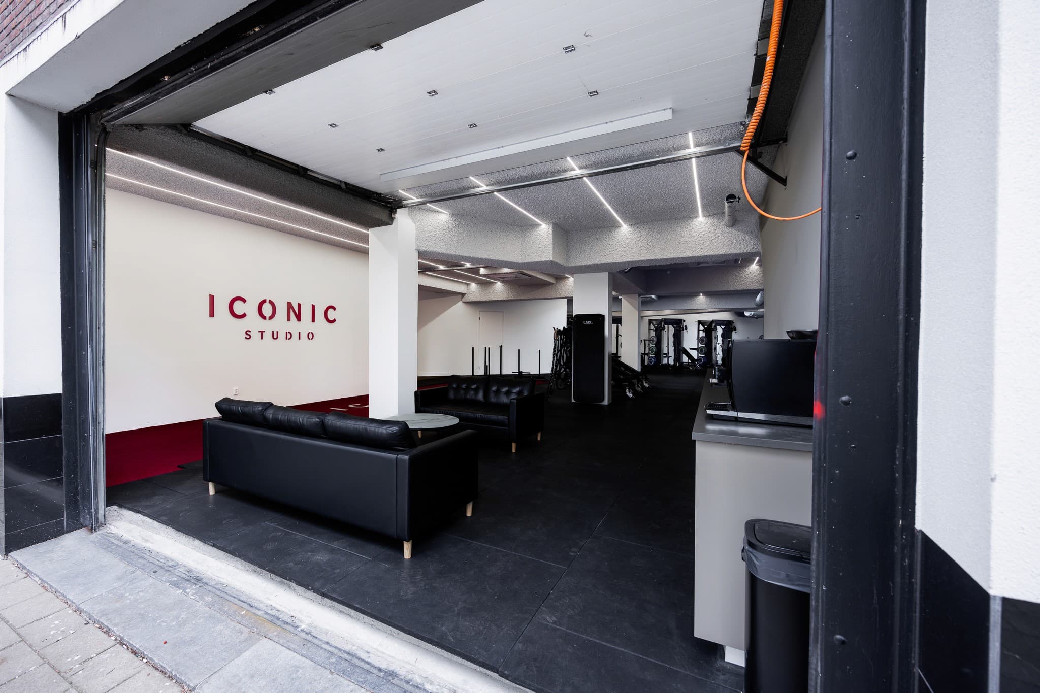 Iconic Studio entrance — open-door view of the studio floor with branded signage